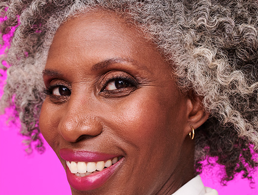 Woman with ombre jet black to silver colored hair