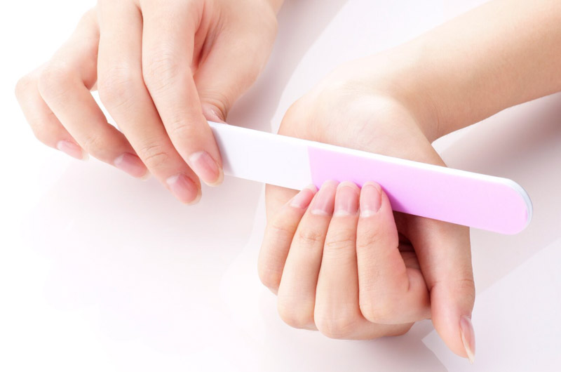 clean nails being filed
