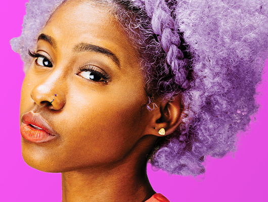 Woman with curly styled Lavender colored hair