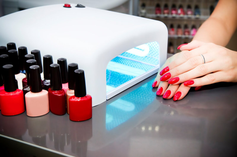 bright red mani next to gel light