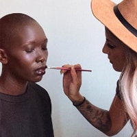 Image of Emily Boulin applying a woman's makeup