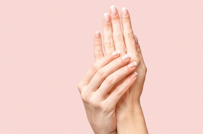 hands on pink background