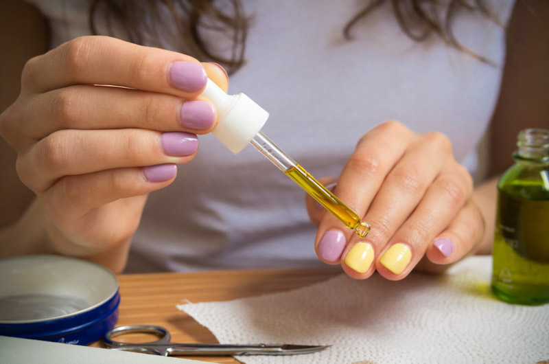 fun purple and yellow mani, applying cutical oil