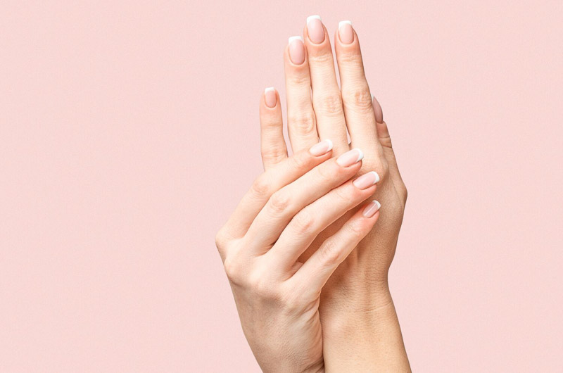 hands on pink background