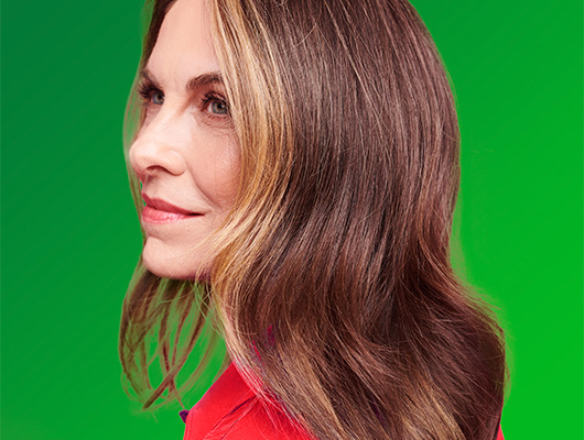 Woman with straight styled Bronde colored hair
